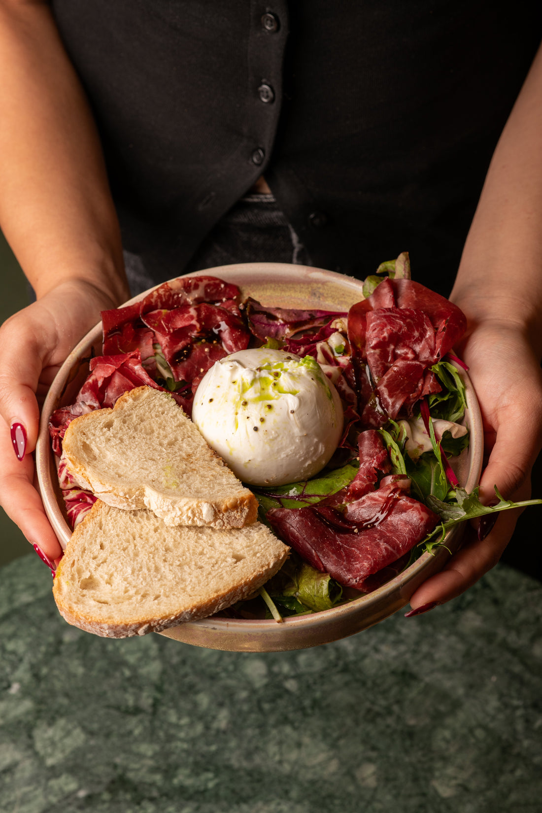 Fresh salad bowl with burrata and leaves at Fiena, King's Cross